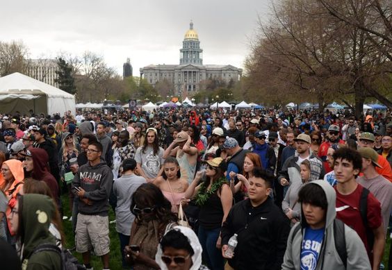 People gather to celebrate during the 4/20 marijuana event at Civic Center Park on April 20, 2017 in Denver.